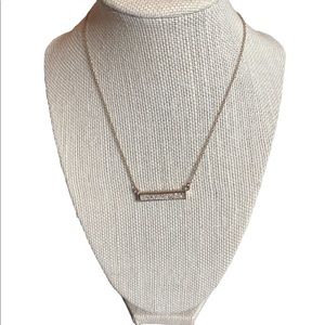 Gold Tone Bar Necklace with Shimmery Diamond-Like Center